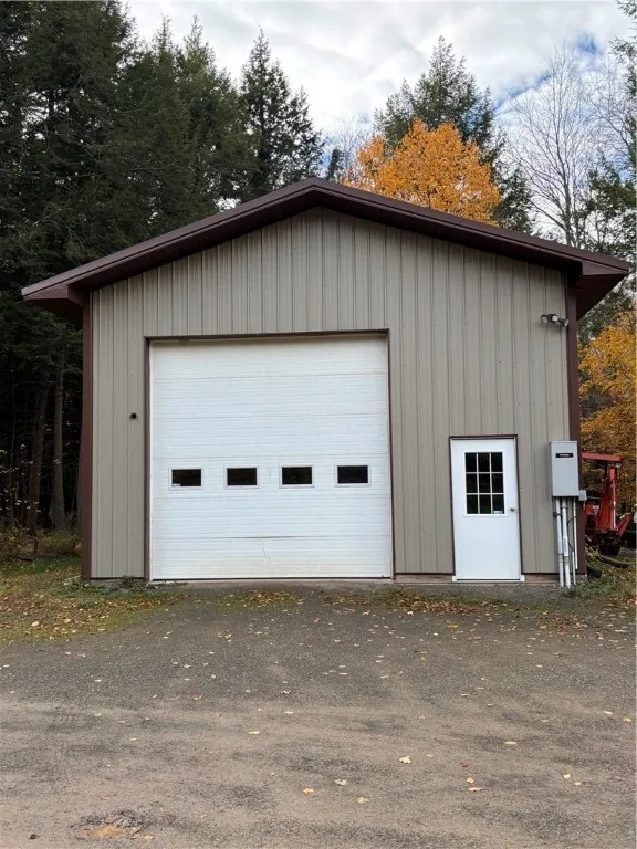 Pole barn style garage with oversized door to fit an RV and other toys!