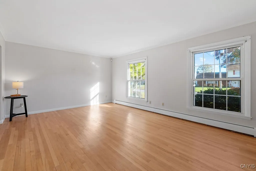 These floors are beautiful and new replacement windows.