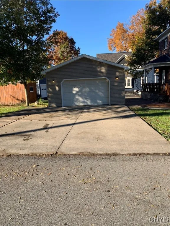 garage with concrete driveway