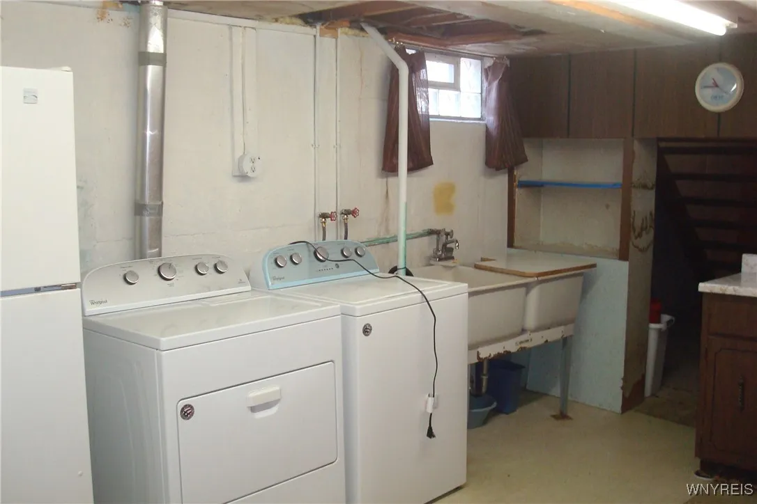 Laundry area includes washer and dryer