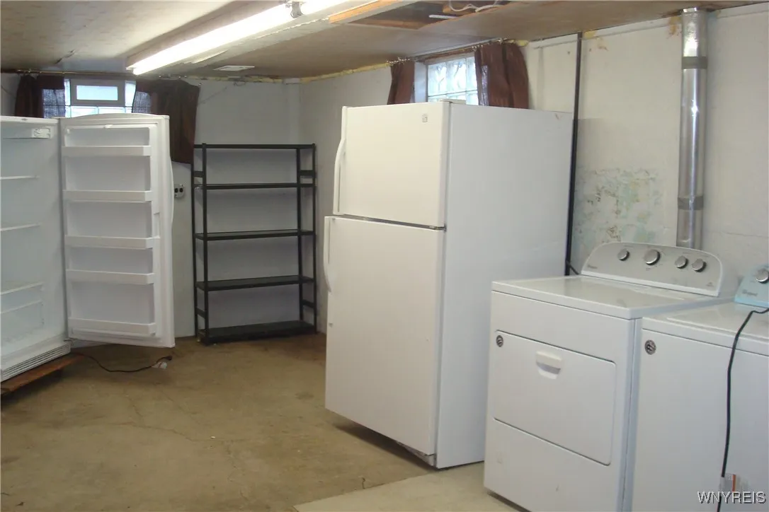 Basement includes freezer and refrigerator