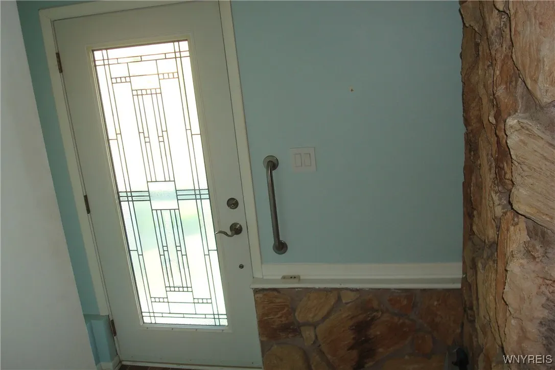 Front foyer is highlighted by stained glass door and has a closet