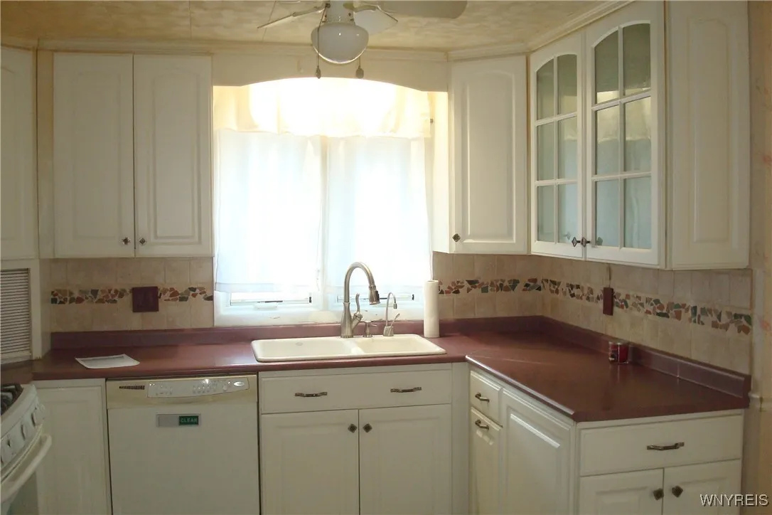 Attractive kitchen with white cabinetry
