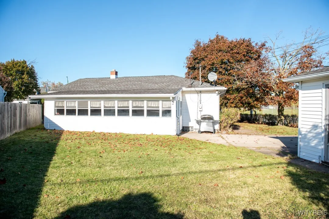 REAR OF PROPERTY SHOWING 25' LONG ENCLOSED PORCH