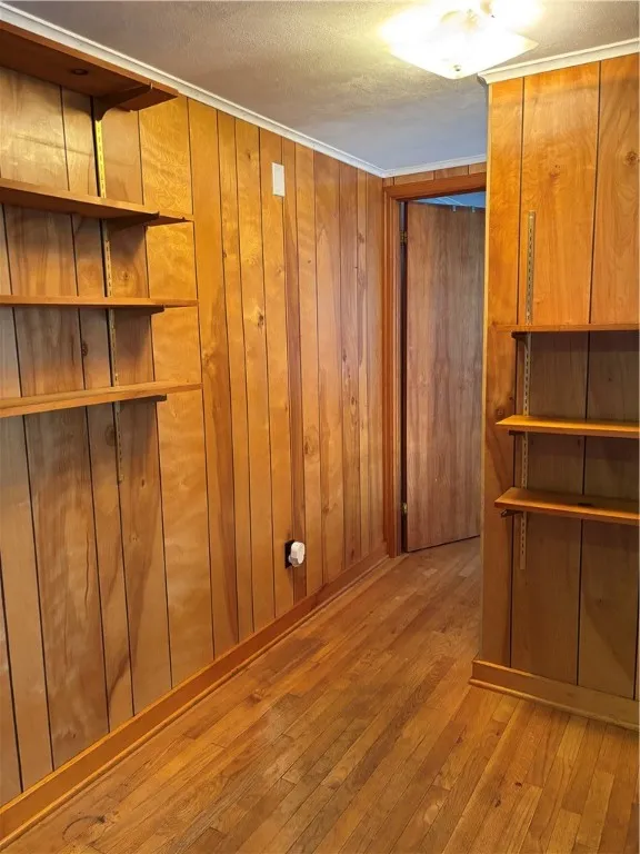 Hall between rooms with shelving