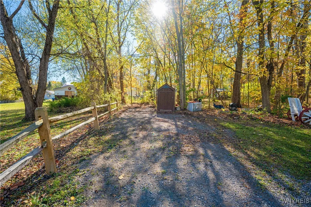 Gravel driveway & shed on extra lot