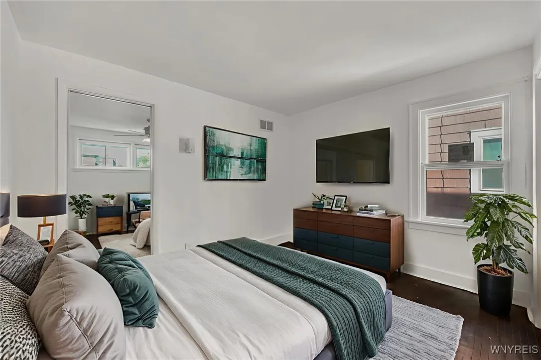 1st floor bedroom 1 with attached room virtually staged