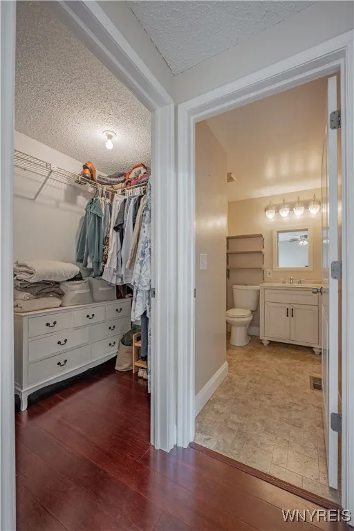 Primary bedroom features a walk-in closet and an updated bath.