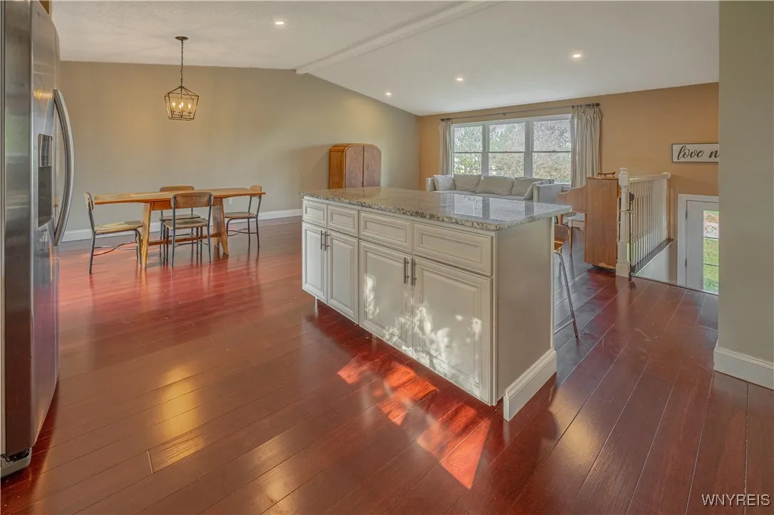 Vaulted ceilings enhance the open, airy feel throughout the home main level.