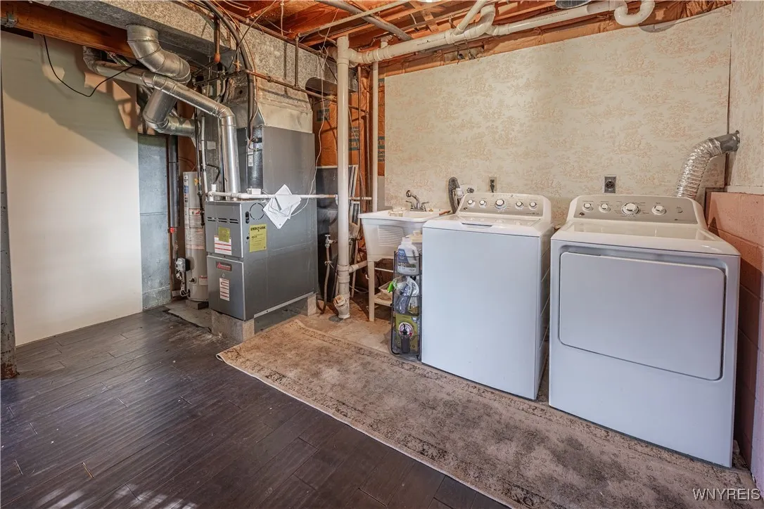 Laundry and mechanical room offer both convenience and storage.