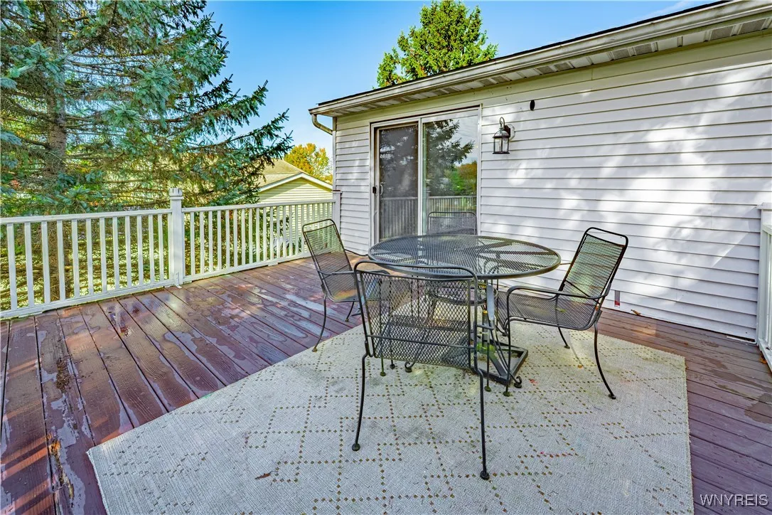 Deck is conveniently located right off the dining area and kitchen, perfect for indoor-outdoor family time.