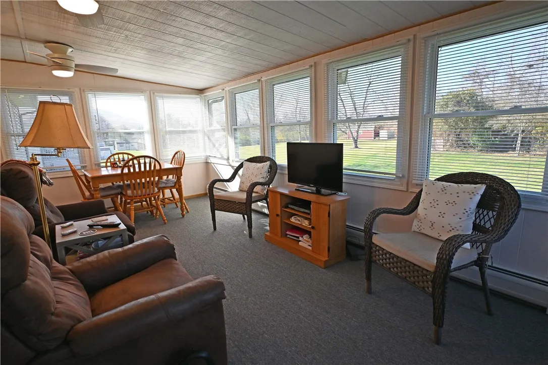 Beautiful sun room overlooking back yard