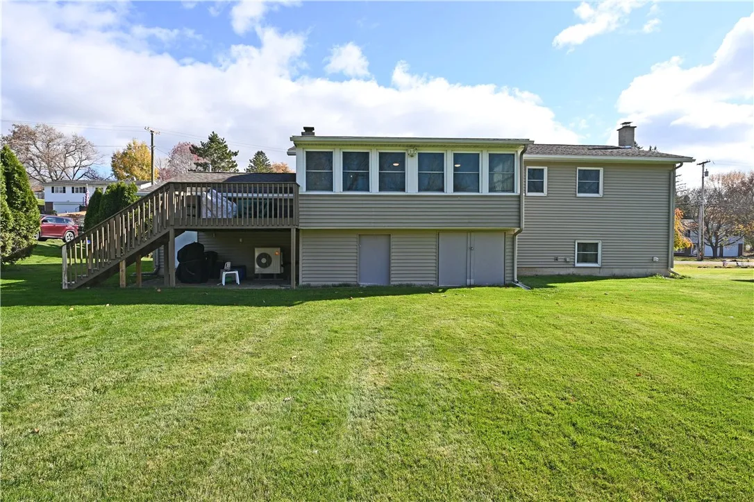 Back of home with storage under sun room