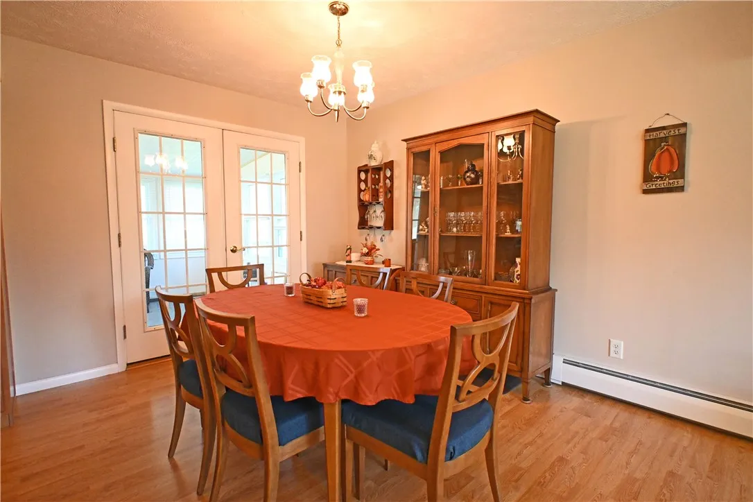 French doors open to heated sun room
