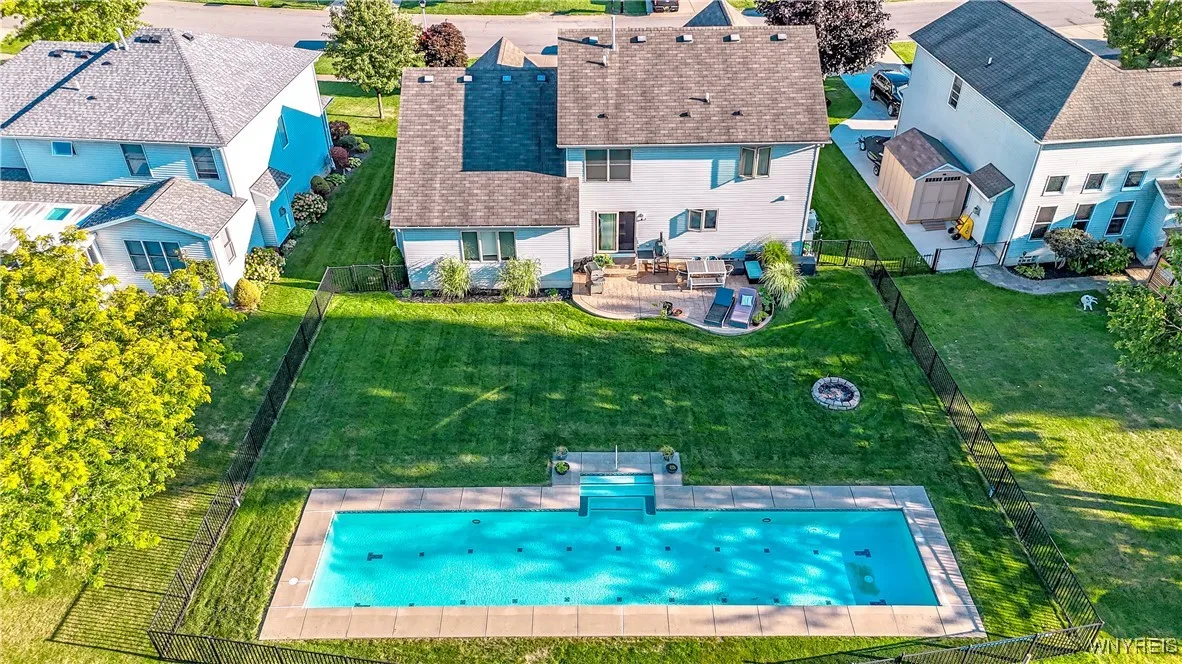 Fully fenced backyard with pool