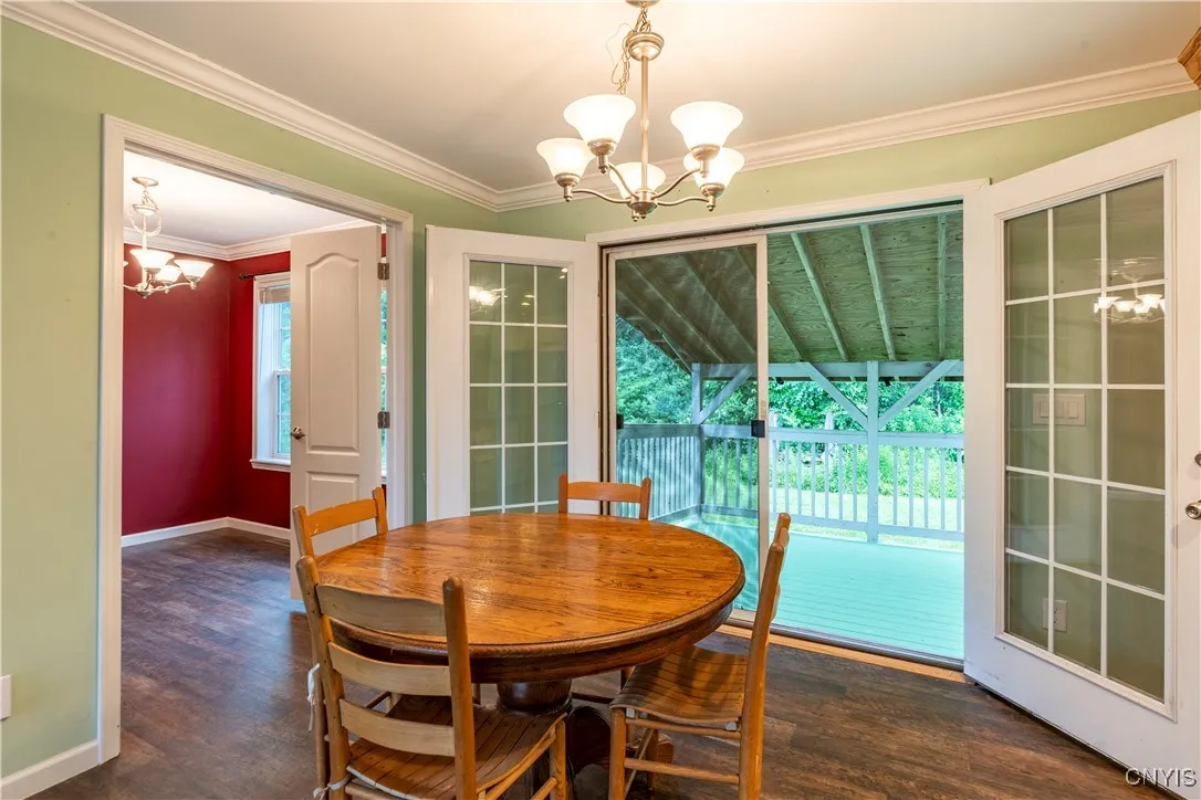 Step through the stunning double atrium doors and out onto a spacious covered porch—perfect for relaxing or entertaining.