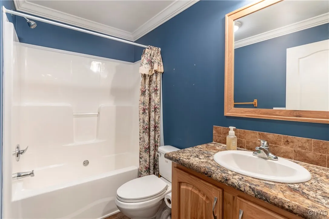 Bedrooms 2 and 3 are thoughtfully separated by a beautifully maintained full bathroom that looks practically brand new.