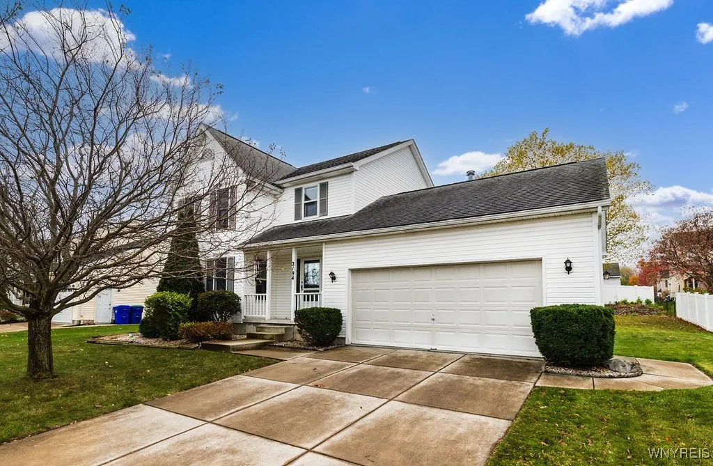 Low maintenance vinyl exterior with double-wide concrete driveway