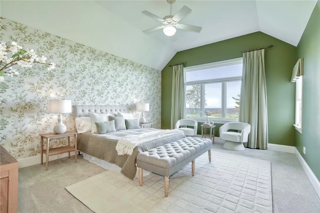 Wake up to the water! Volume ceilings, generous windows, and a true exhale—the primary suite lives on the first floor, so mornings start with the lake.