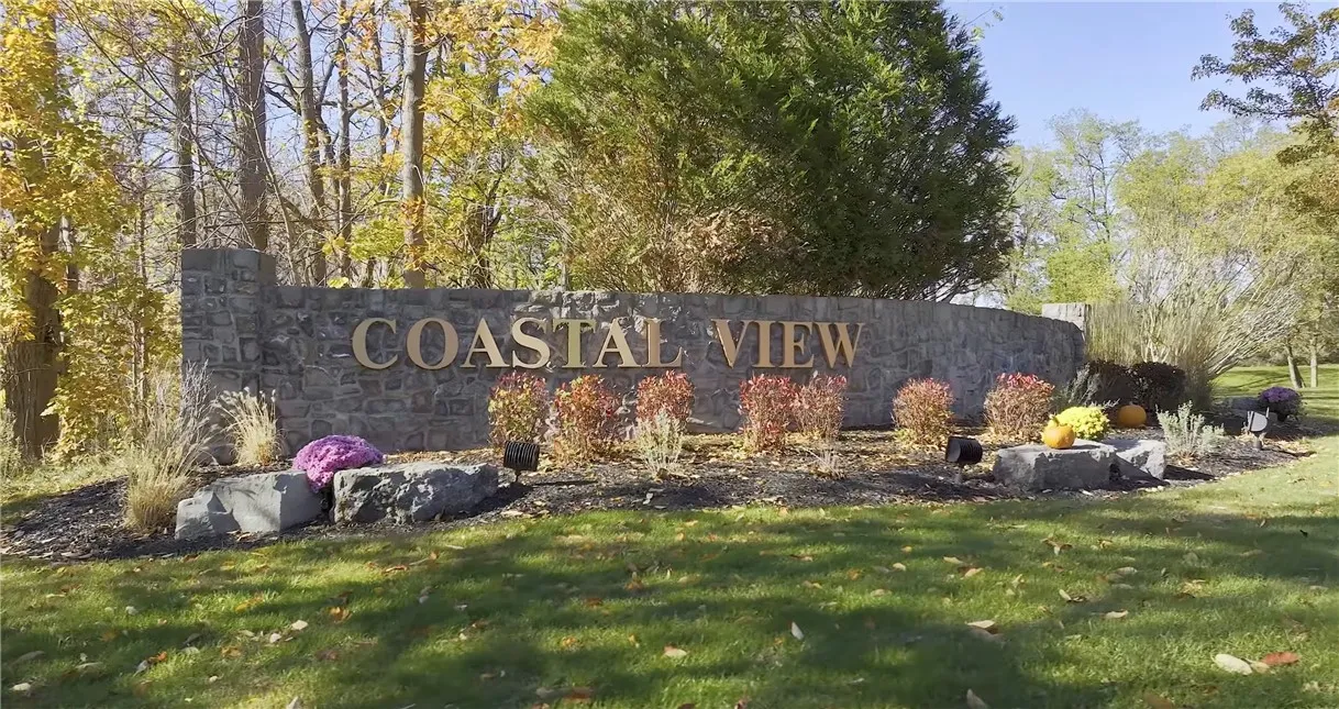 Coastal View offers unobstructed lake views, access to the shoreline and Four Mile Creek, and beautifully maintained common green spaces. The HOA handles landscaping and snow removal for shared areas, along with refuse service for each home — making lakefront living effortless.