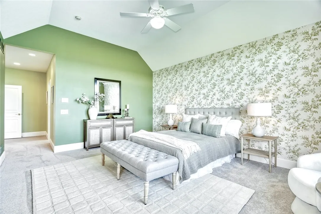 Wake up to the water! Volume ceilings, generous windows, and a true exhale—the primary suite lives on the first floor, so mornings start with the lake.