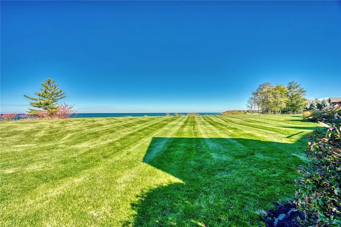 From the deck to the level backyard, the lake is always the backdrop.