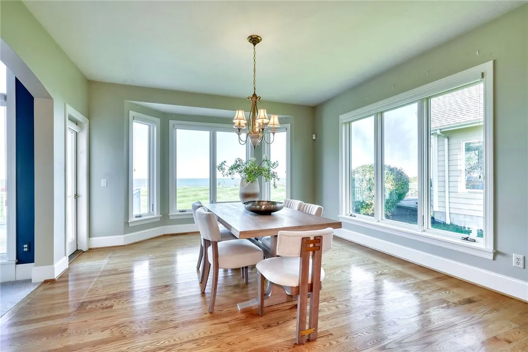 Dining is wrapped in windows and opens to the composite deck for easy summer nights.