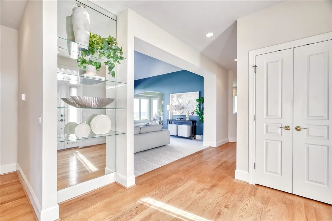 Spacious sunlit foyer/entry with views of the lake as soon as you enter.