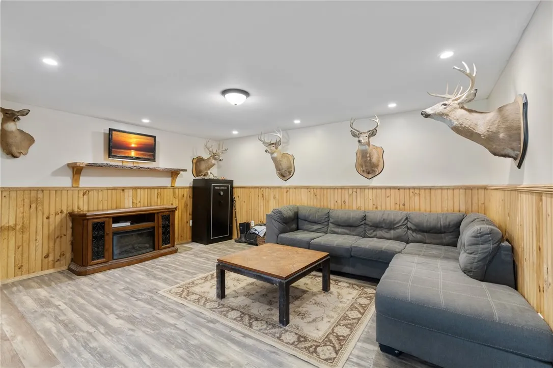 The LOWER LEVEL family room- a great teen space (there’s two adjacent bedrooms and plenty of room for a hobby shop too!)