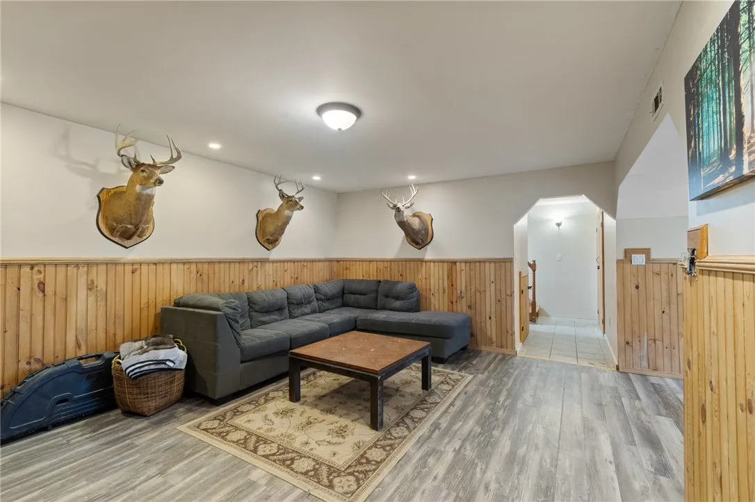 The LOWER LEVEL family room- there’s two bedrooms and an WALK OUT to the rear yard off this space too!