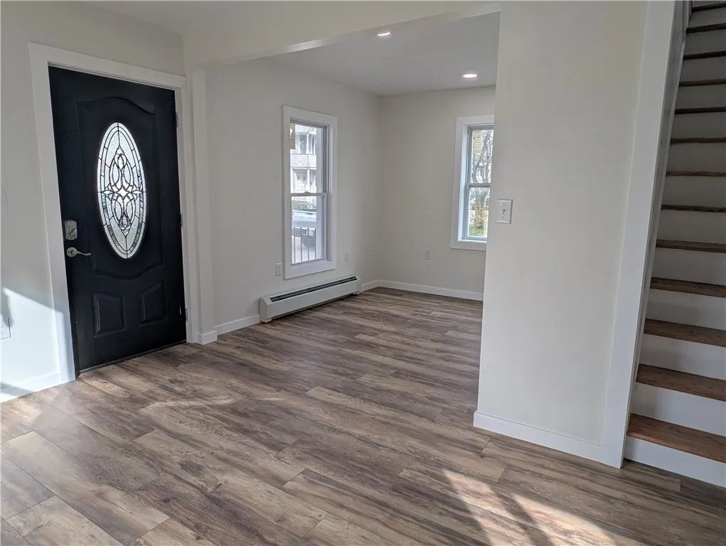 Front door and den just off of it.