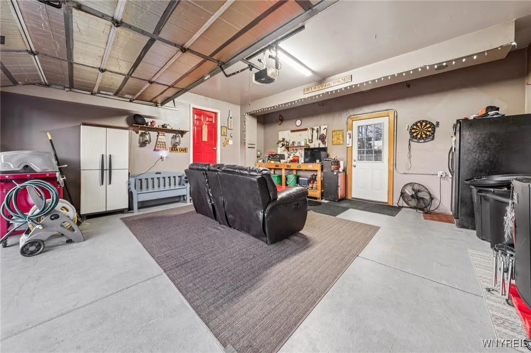 garage currently used as "man cave" but easily converted to typical garage use. Has two separate doors for convenient access.