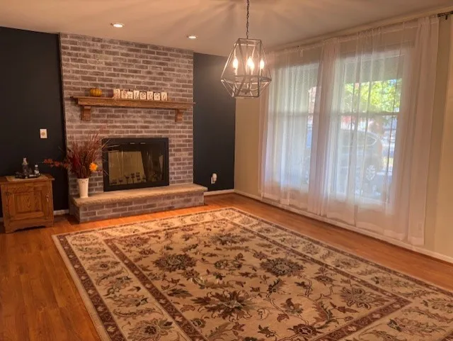 Formal Dining Room features Hardwood Floors and Wood Burning Fireplace