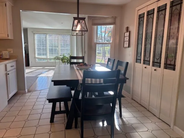 Eat-in Area of Kitchen Features Pantry/Shelves with Beautiful Etched Glass Doors