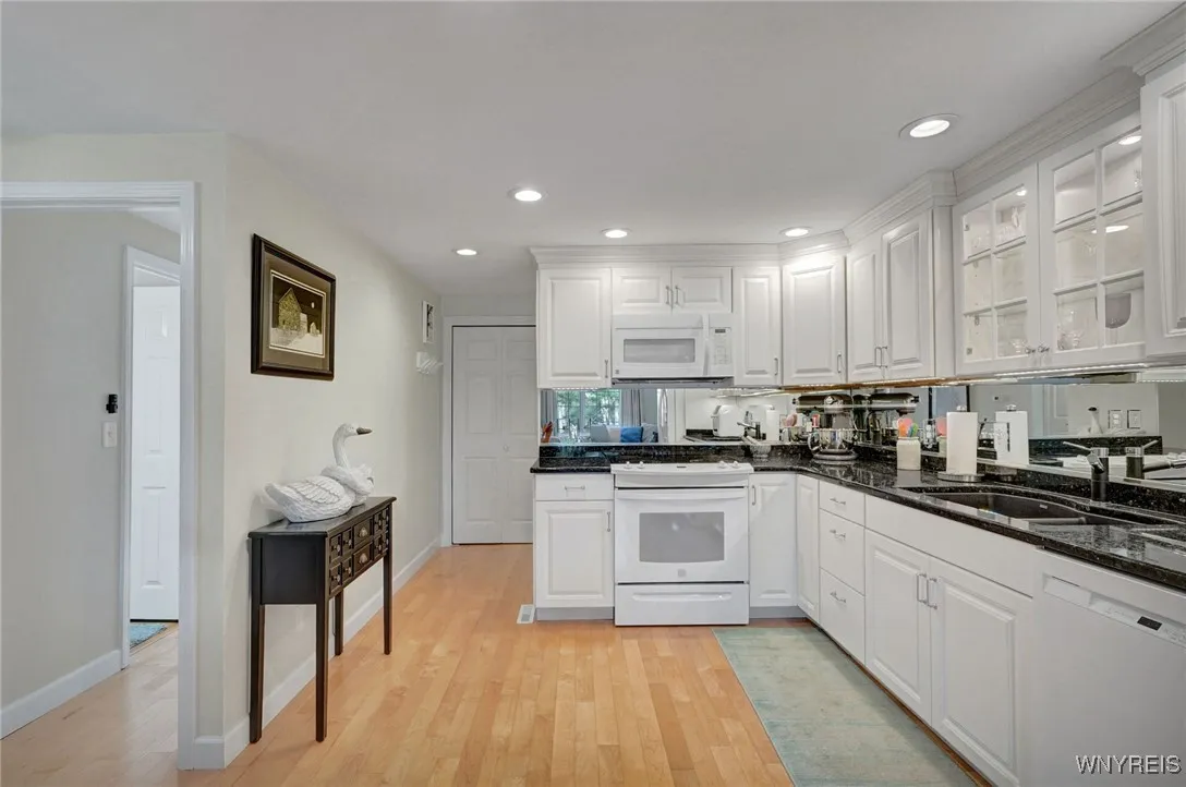 Beautiful granite counters with contrasting self close cabinets