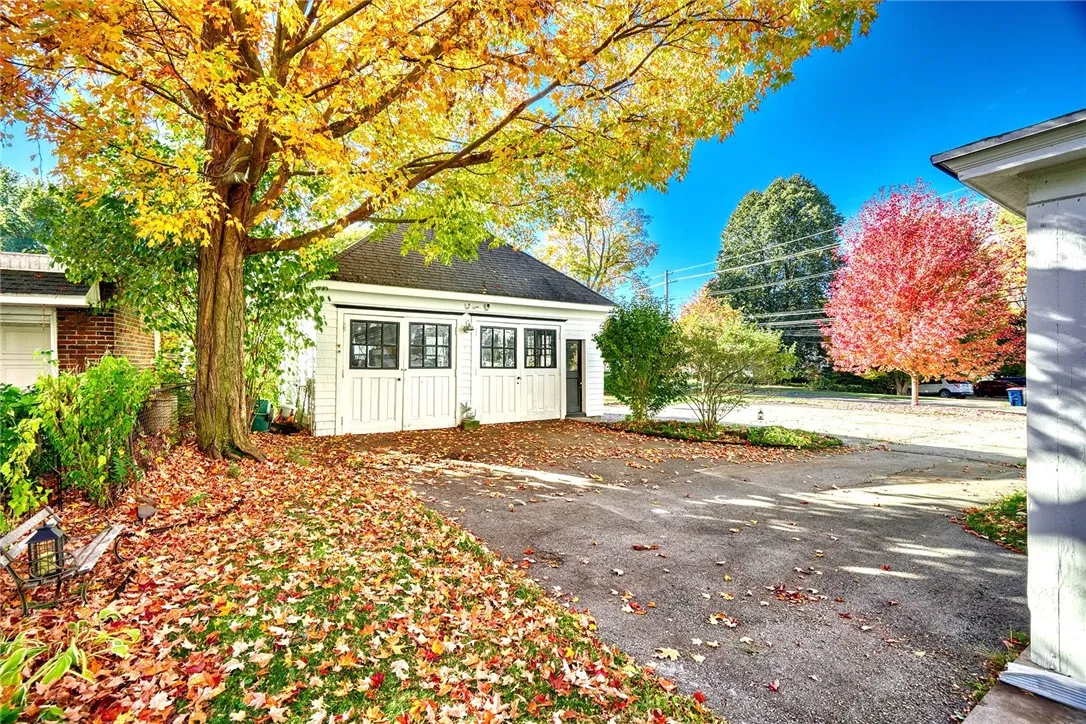 A CARRIAGE-STYLE GARAGE adds to the home’s charm