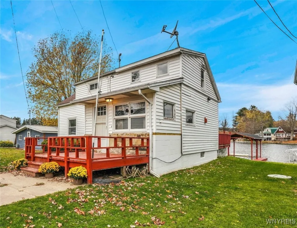 Street side view of entry and deck