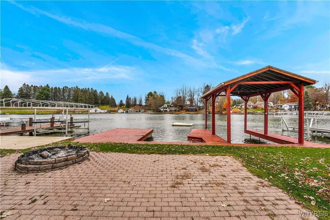 Patio, firepit and three docks, boat port large enough for pontoon boat