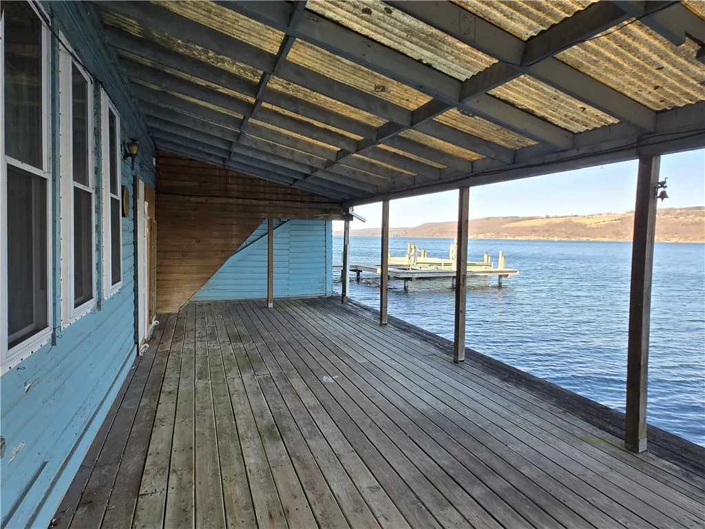 The deck is covered, the flat approach to Seneca Lake makes it simple to enjoy the water, launch boats, fish, or just sit lakeside without stairs or cliffs getting in the way. A Rare find!