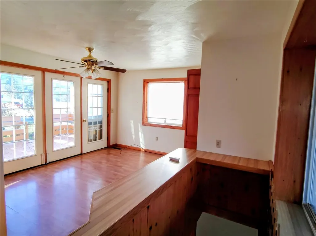 sunlit bonus room leading to finished basement room