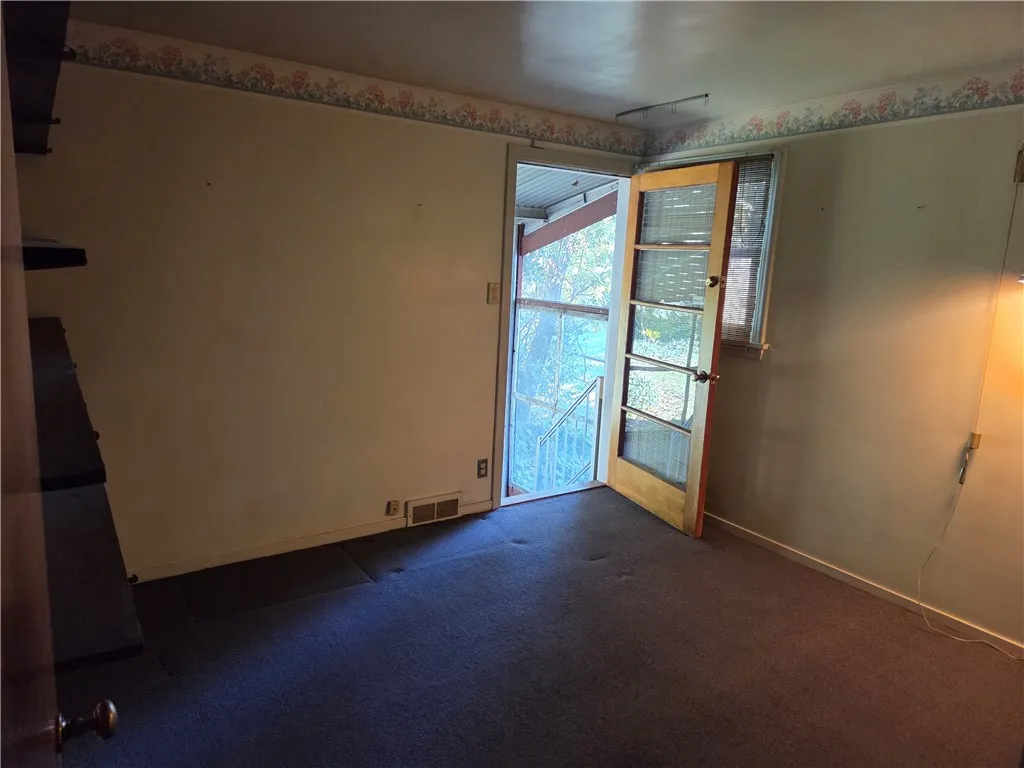 Bedroom 3 with access to screen porch.