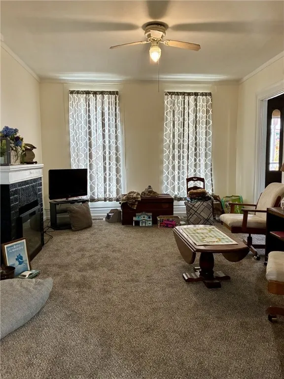 The living room has tall ceilings, electric fireplace and is very spacious