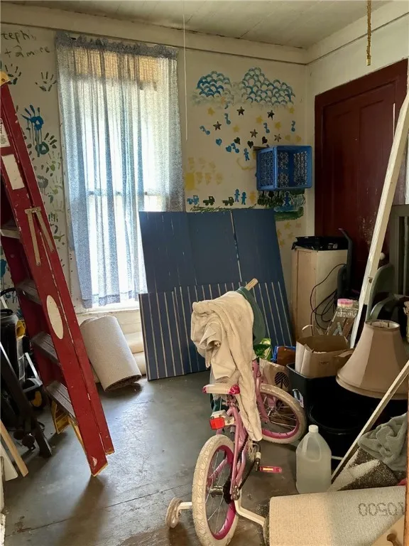 This laundry room has washer/dryer hookups, built-in cupboards, lots of room for mudroom storage and the quarter bath is tucked away in this room as well.