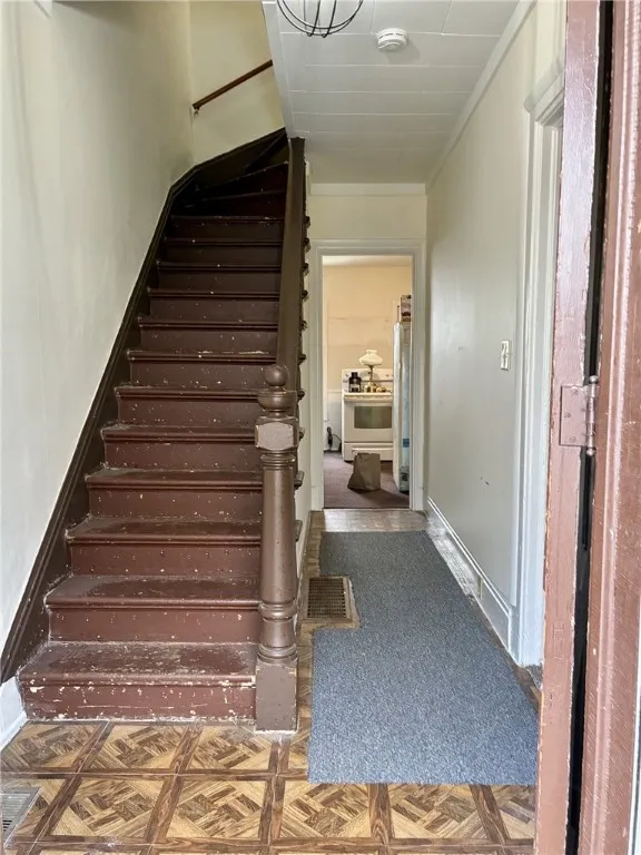The original banister and staircase is just waiting for a little shine