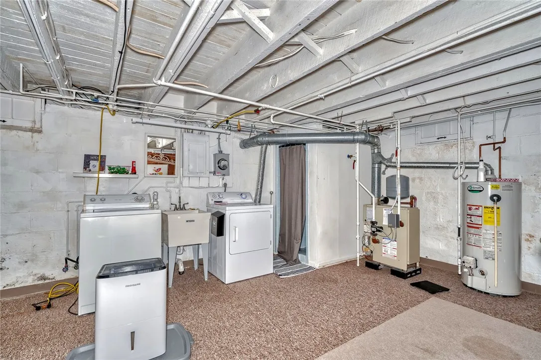 Part-finished basement with laundry area and tiled shower