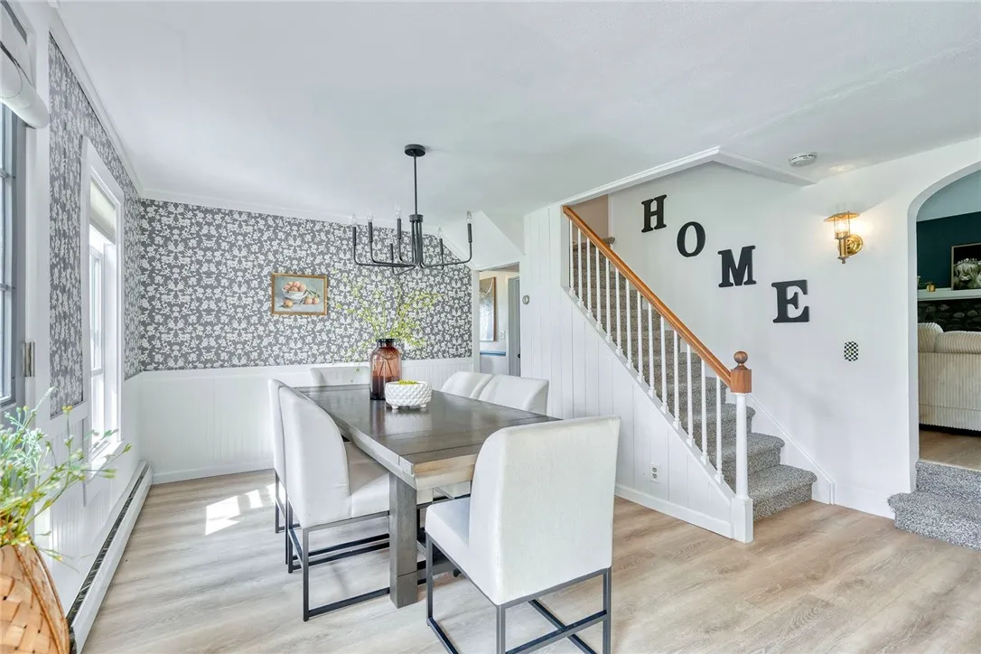 Formal Dining Space is the heart of the home! Refreshed with style and connects all main living areas.