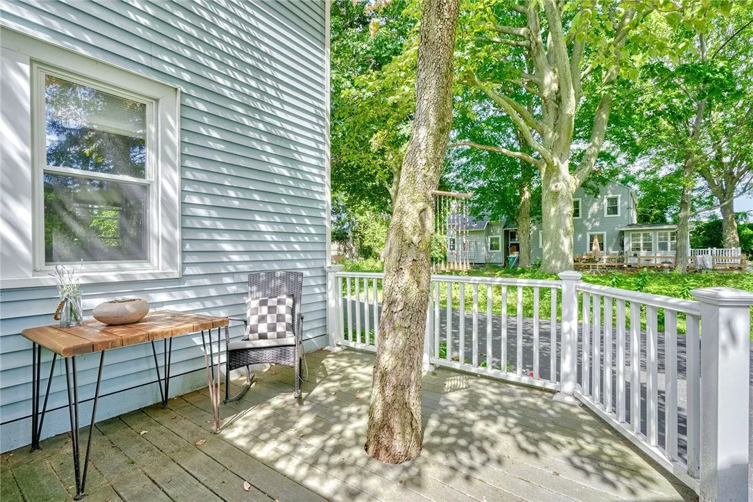 Relax on the shaded composite deck overlooking the private backyard