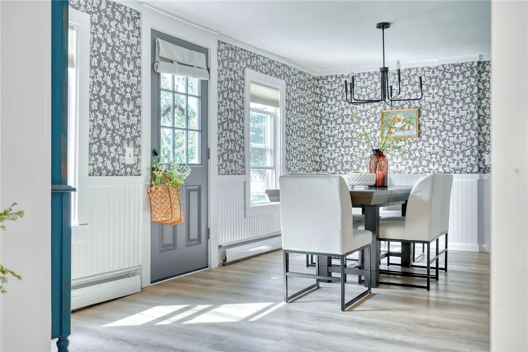 Formal Dining Space is the heart of the home! Refreshed with style and connects all main living areas.