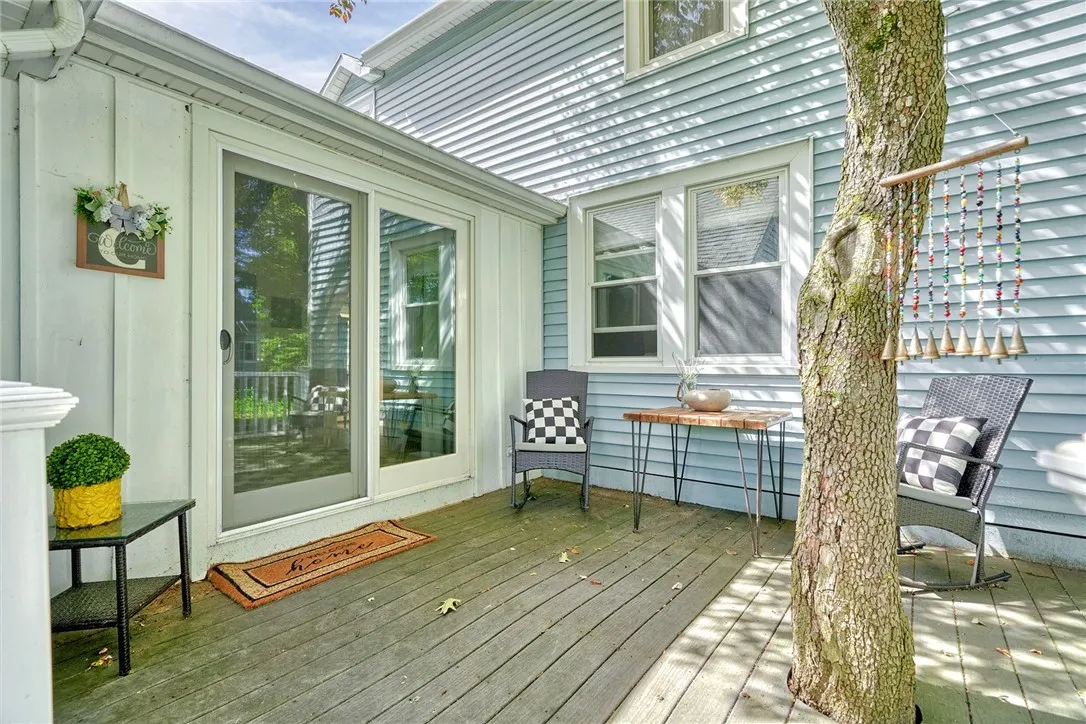 Relax on the shaded composite deck overlooking the private backyard