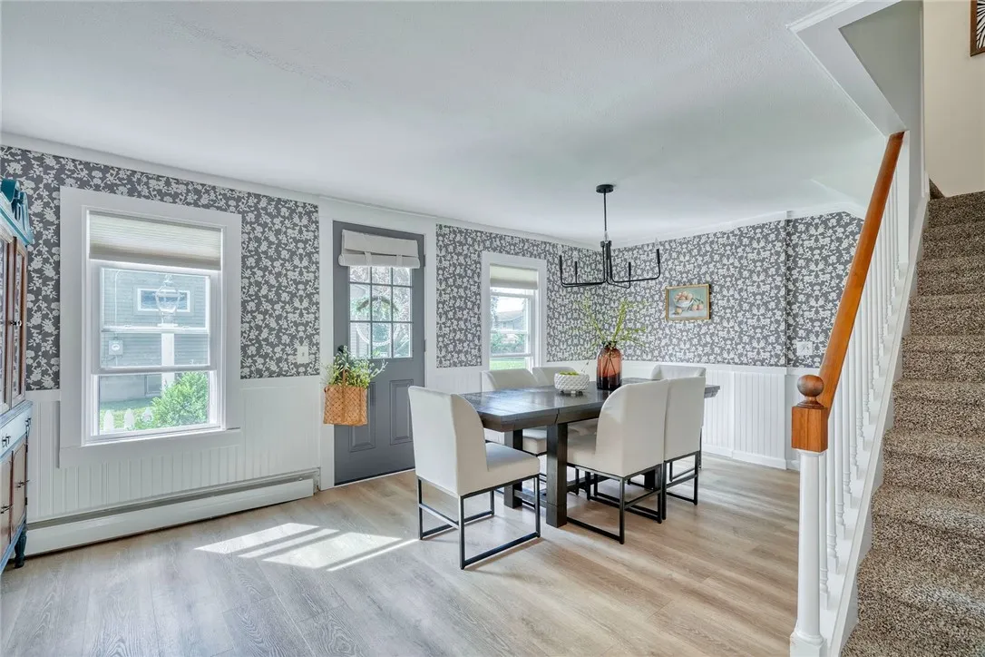 Formal Dining Space is the heart of the home! Refreshed with style and connects all main living areas.